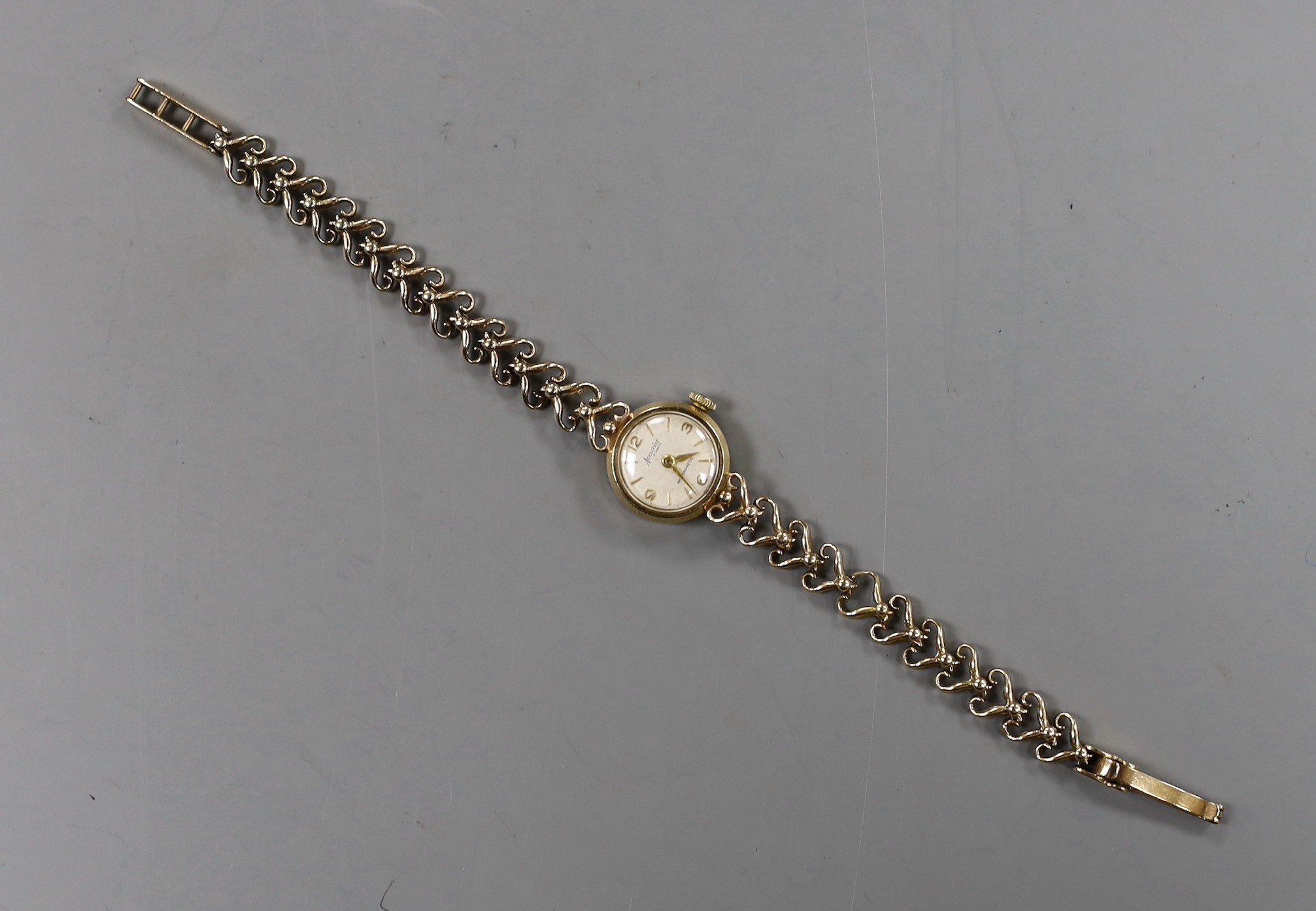 A lady's 9ct gold Accurist manual wind wrist watch, on a 9ct gold bracelet, overall 17.8cm, gross weight 14.1 grams.